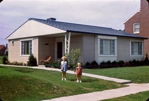 lustron metal houses|1950 prefab home with fireplace.